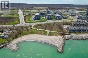 Grimsby condo for rent - A bird's eye view of a coastal town with a bridge and buildings.