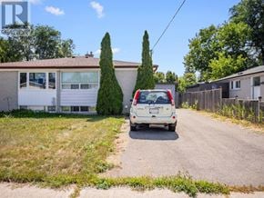 Richmond Hill (Crosby) apartment for rent - A white van is parked on a driveway in front of a house.