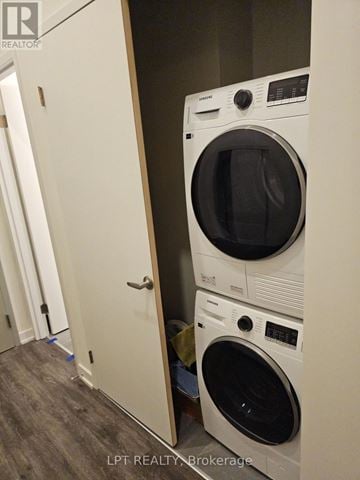 Welland (Broadway) condo for rent - A white dryer and washer are stacked on top of each other.