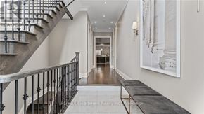 Oakville (Co Central) apartment for rent - A staircase with a metal railing and a bench on the bottom.