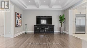 Oakville (Co Central) apartment for rent - A living room with a tv and a plant.