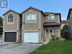 Barrie (Painswick South) apartment for rent - A brick house with a garage door is for sale.