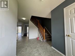 Barrie (Painswick South) apartment for rent - A hallway with a staircase and a door on the right.