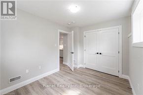 Guelph (Exhibition Park) apartment for rent - A white room with a door and a window.