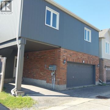 Markham (Cornell) apartment for rent - A house with a grey garage door and a brick wall.
