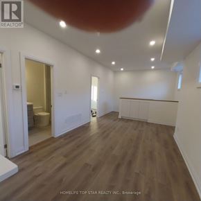 Markham (Cornell) apartment for rent - A room with wooden flooring and white walls.