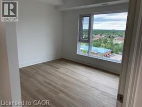 Brantford apartment for rent - A room with a window overlooking a residential area.