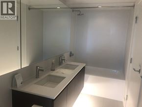 Richmond apartment for rent - A bathroom with a sink and mirror.