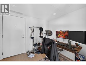 Burnaby apartment for rent - A room with a desk, chair, and a computer monitor.