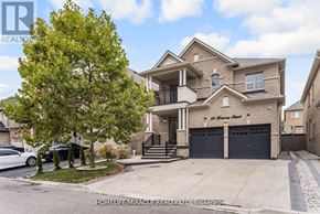 Brampton (Credit Valley) apartment for rent - A large house with a tree in front of it.