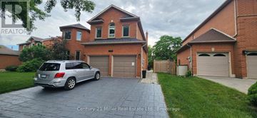Oakville (Ro River Oaks) apartment for rent - A silver car is parked in front of a house with a garage.