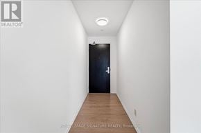 Toronto (Waterfront Communities) condo for rent - A hallway with a door at the end.