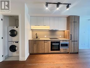 Toronto (Forest Hill South) condo for rent - A modern kitchen with wooden cabinets and stainless steel appliances.