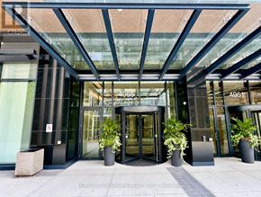 Toronto (Willowdale East) condo for rent - The front of a building with a glass entrance and a sign that reads 4951.