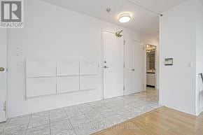 Toronto (Willowdale East) condo for rent - A white room with a door and a wall with a sign that says "REALTOR".
