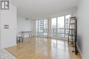 Toronto (Willowdale East) condo for rent - A room with a wooden floor and a ladder leaning against the wall.