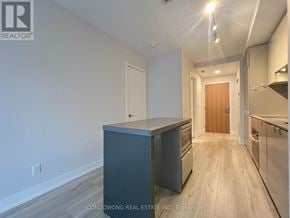 Toronto (Bay Street Corridor) condo for rent - A kitchen area with a countertop and cabinets.