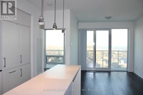 Toronto (Waterfront Communities) condo for rent - A realtor photo of an empty room with a view of the city.