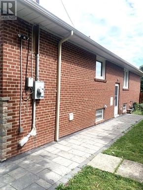 Toronto (Newtonbrook East) apartment for rent - A red brick house with a white door and windows.