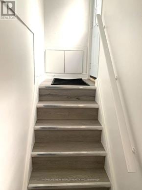 Toronto (Newtonbrook East) apartment for rent - A staircase with a black mat on the bottom step.
