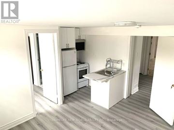 Toronto (Newtonbrook East) apartment for rent - A small kitchen with a sink and a refrigerator.