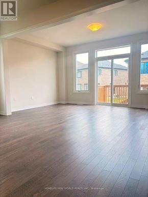 Pickering townhouse for rent - A room with wooden flooring and a sliding glass door.