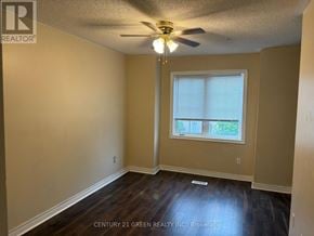 Mississauga (Meadowvale Village) apartment for rent - A room with a ceiling fan and a window.