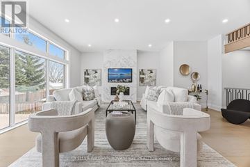 Pickering (West Shore) apartment for rent - A living room with white furniture and a large window.