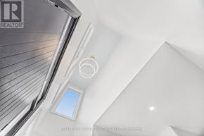 Pickering (West Shore) apartment for rent - A white ceiling with a small window and a logo for Keller Williams Advantage Realty in Brokerage.
