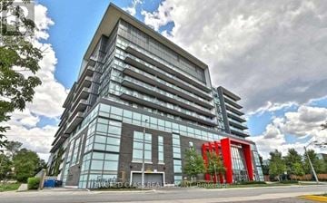 Toronto (Downsview-Roding-Cfb) condo for rent - A modern multi-story building with a red sculpture in front.