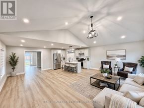South Huron (Exeter) apartment for rent - A spacious living room with a kitchen in the background.