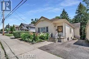 London South (South H) apartment for rent - A house with a front yard and a driveway is shown in the image.
