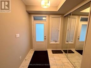 Brant (Paris) townhouse for rent - A hallway with a glass door leading to a balcony.