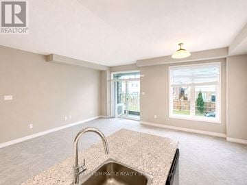 Brant (Paris) townhouse for rent - A kitchen with a granite countertop and a sink is shown.