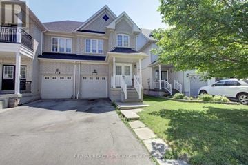 Mississauga (Meadowvale Village) apartment for rent - A large house with a white garage door is for sale.