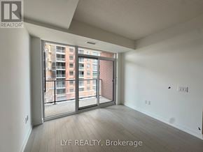Toronto (Humber Heights) condo for rent - A room with a sliding glass door leading to a balcony.