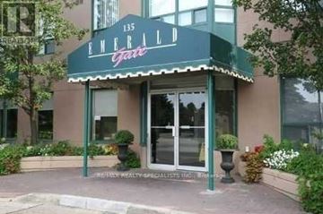 Mississauga (Cooksville) condo for rent - The front of a building with the number 135 and the words Emerald Lane on it.