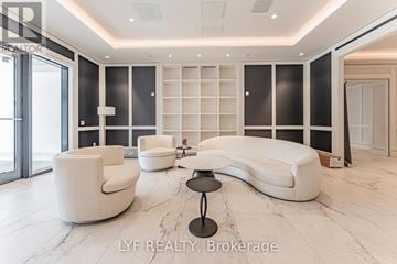 Toronto (Humber Heights) condo for rent - A modern living room with white furniture and a marble floor.