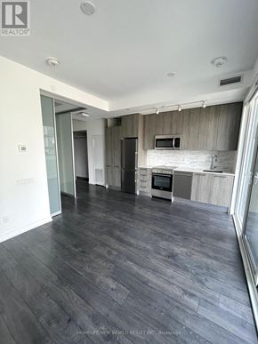 Toronto (Church-Yonge Corridor) condo for rent - A spacious living room with a grey floor and white walls.