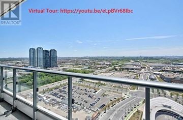 Vaughan (Vaughan Corporate Centre) condo for rent - A virtual tour link is displayed on a balcony overlooking a cityscape.