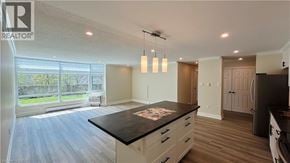 London condo for rent - A spacious kitchen with a large island in the middle.