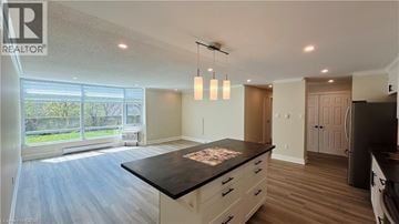 London condo for rent - A spacious kitchen with a large island in the middle.