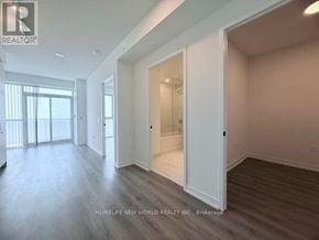 Vaughan (Vaughan Corporate Centre) condo for rent - A spacious room with a sliding door leading to another room.