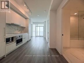 Vaughan (Vaughan Corporate Centre) condo for rent - A spacious kitchen with white cabinets and a marble backsplash.