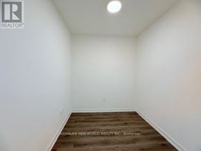Vaughan (Vaughan Corporate Centre) condo for rent - A room with white walls and wooden flooring.