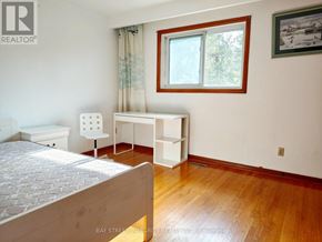 Toronto (L'amoreaux) apartment for rent - A bedroom with a bed, desk, and chair.