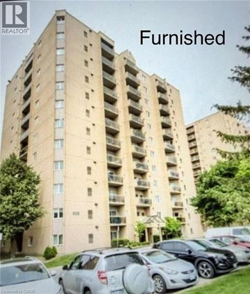 London condo for rent - A tall apartment building with the word "Furnished" written above it.