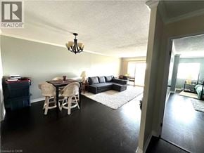 London condo for rent - A living room with a dining table and chairs.