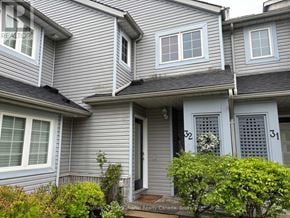 Blue Mountains townhouse for rent - A grey house with the number 31 on the door.