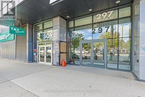 Toronto (Kensington-Chinatown) condo for rent - A hallway with a black door and a carpet with a grey and white pattern.